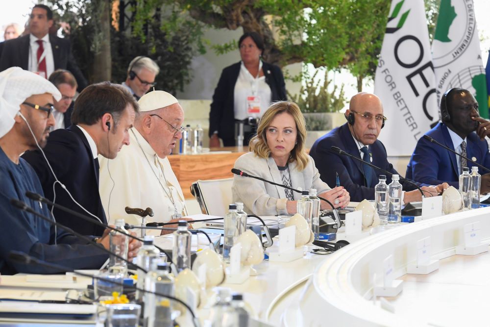 Italian Prime Minister Giorgia Meloni looks on as Pope Francis gives a speech. Italian Prime Minister Giorgia Meloni looks on as Pope Francis gives a speech.